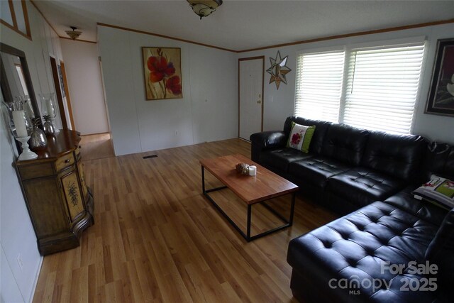 236 Boxwood Church Rd, Mocksville, NC 27028 - living room with light wood-style flooring and ornamental molding
