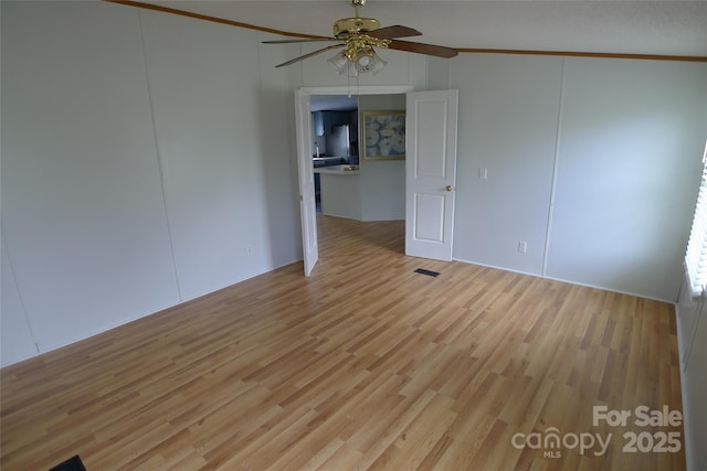 236 Boxwood Church Rd, Mocksville, NC 27028 - unfurnished room with ornamental molding, ceiling fan, and wood finished floors