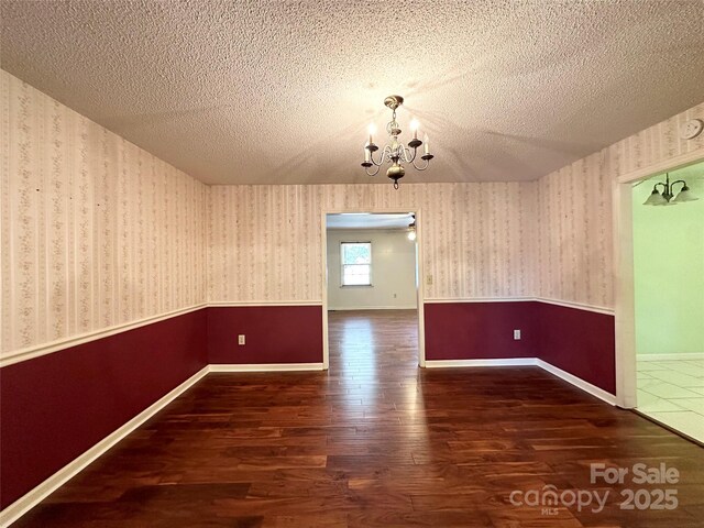 1164 Hidden Lake Dr Unit 10, Granite Falls, NC 28630 - unfurnished dining area featuring wood finished floors, a textured ceiling, and a chandelier