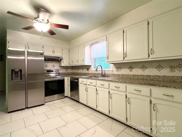 1164 Hidden Lake Dr Unit 10, Granite Falls, NC 28630 - kitchen featuring stainless steel appliances, under cabinet range hood, light marble finish flooring, a ceiling fan, and decorative backsplash