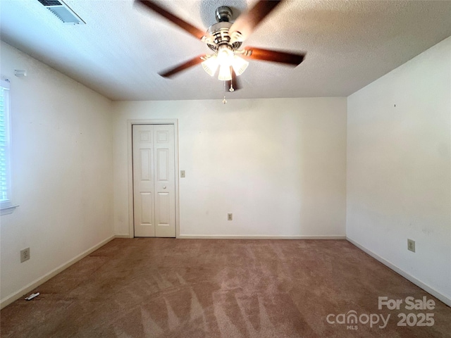 1164 Hidden Lake Dr Unit 10, Granite Falls, NC 28630 - carpeted empty room with ceiling fan and a textured ceiling