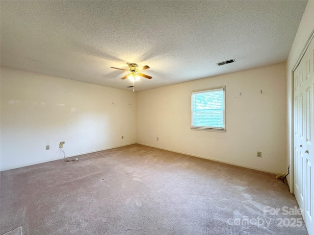 1164 Hidden Lake Dr Unit 10, Granite Falls, NC 28630 - unfurnished bedroom featuring light carpet, a textured ceiling, a ceiling fan, and a closet