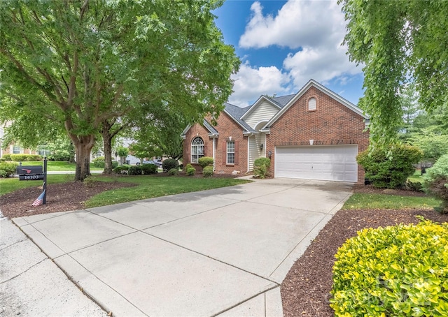 14103 Hiawatha Ct, Huntersville, NC 28078 - view of front of home featuring brick siding, an attached garage, concrete driveway, and a front yard