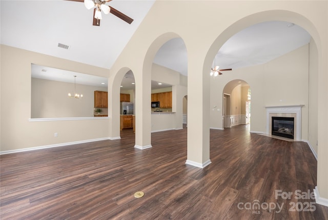 14103 Hiawatha Ct, Huntersville, NC 28078 - unfurnished living room featuring a ceiling fan, high vaulted ceiling, dark wood finished floors, and a high end fireplace