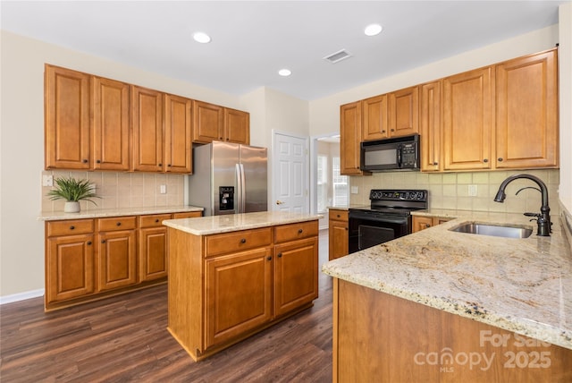 14103 Hiawatha Ct, Huntersville, NC 28078 - kitchen with black appliances, light stone counters, dark wood-style floors, tasteful backsplash, and a kitchen island