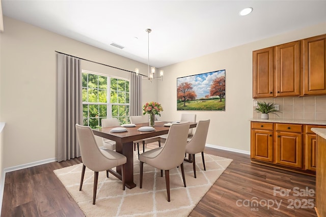 14103 Hiawatha Ct, Huntersville, NC 28078 - dining room with dark wood-type flooring, a chandelier, and recessed lighting