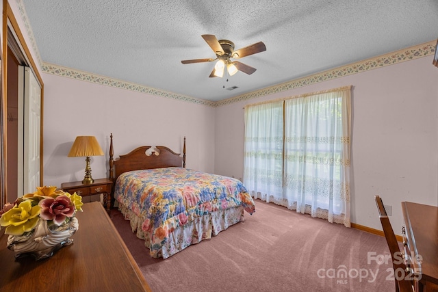 324 Swamp Fox Dr, Fort Mill, SC 29715 - carpeted bedroom featuring a textured ceiling, a ceiling fan, and a closet