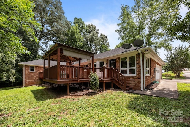 324 Swamp Fox Dr, Fort Mill, SC 29715 - back of house featuring brick siding, a yard, a deck, and a garage