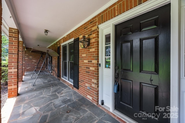 324 Swamp Fox Dr, Fort Mill, SC 29715 - property entrance with a porch and brick siding