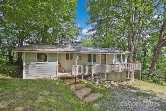 56 Faraway Dr, Cullowhee, NC 28723 - view of front of home featuring a porch, a chimney, a metal roof, and a front yard