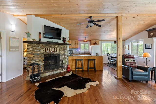 56 Faraway Dr, Cullowhee, NC 28723 - living area featuring lofted ceiling, hardwood / wood-style floors, wooden ceiling, ceiling fan, and a fireplace