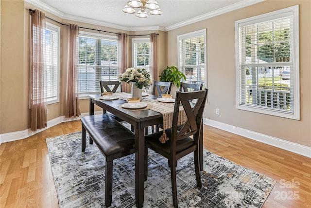 2040 Brantley Creek Dr, Kannapolis, NC 28083 - dining area with a chandelier, ornamental molding, and light wood-style floors