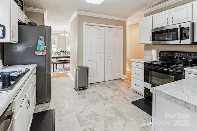 2040 Brantley Creek Dr, Kannapolis, NC 28083 - kitchen with stainless steel appliances, ornamental molding, white cabinetry, light countertops, and a chandelier