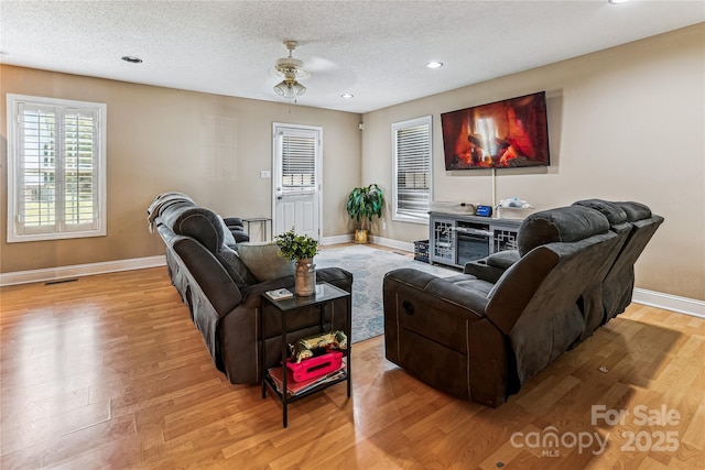 2040 Brantley Creek Dr, Kannapolis, NC 28083 - living room featuring light wood-style flooring, recessed lighting, a textured ceiling, and ceiling fan