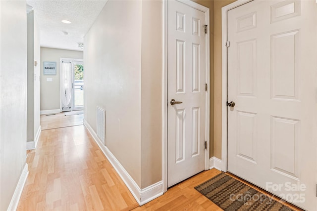 2040 Brantley Creek Dr, Kannapolis, NC 28083 - corridor with light wood-type flooring and a textured ceiling