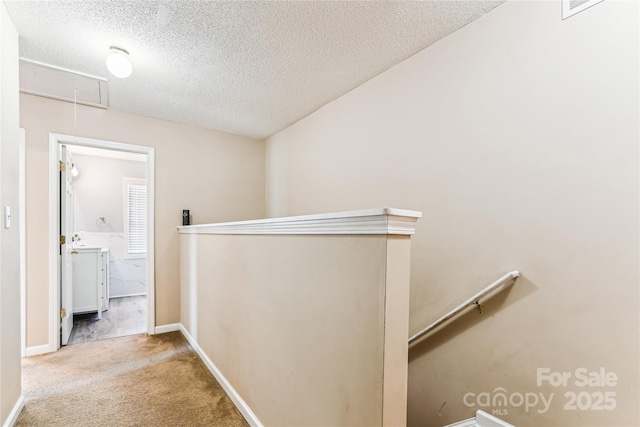 2040 Brantley Creek Dr, Kannapolis, NC 28083 - hall featuring attic access, an upstairs landing, a textured ceiling, and carpet