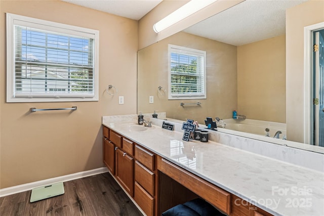 2040 Brantley Creek Dr, Kannapolis, NC 28083 - full bath featuring wood finished floors, vanity, and a bathtub