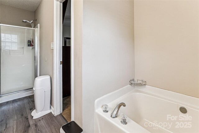 2040 Brantley Creek Dr, Kannapolis, NC 28083 - full bath with a garden tub, wood finished floors, and an enclosed shower