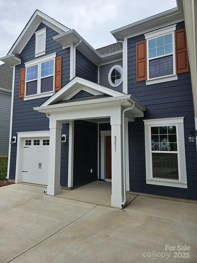 8231 Annsborough Dr NW, Concord, NC 28027 - view of front of home featuring a garage and driveway