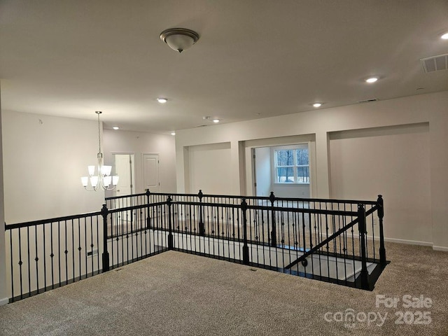 8231 Annsborough Dr NW, Concord, NC 28027 - carpeted spare room featuring a chandelier and recessed lighting