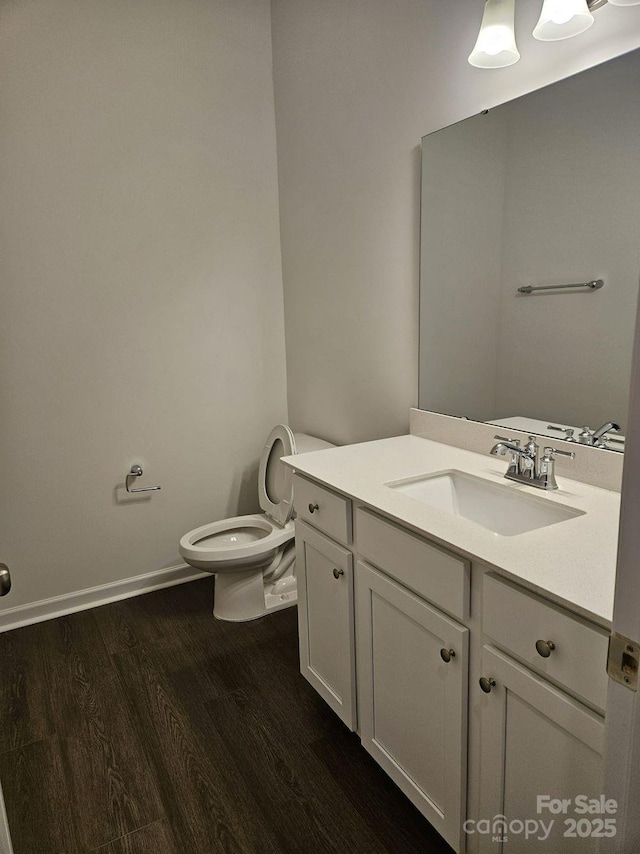 8231 Annsborough Dr NW, Concord, NC 28027 - bathroom with wood finished floors and vanity