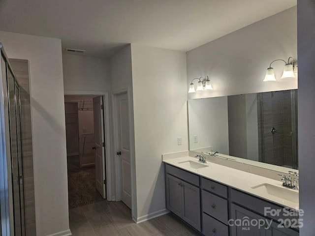 8231 Annsborough Dr NW, Concord, NC 28027 - full bathroom featuring double vanity and a shower stall