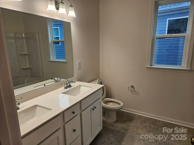 8231 Annsborough Dr NW, Concord, NC 28027 - bathroom with double vanity and shower / bath combination