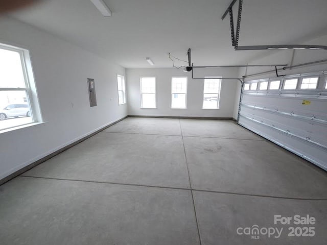 8231 Annsborough Dr NW, Concord, NC 28027 - garage featuring a garage door opener and electric panel