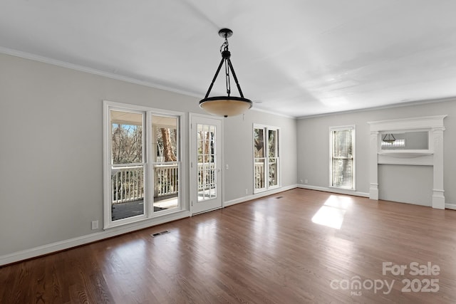 6017 Millbury Ct, Charlotte, NC 28211 - unfurnished dining area featuring plenty of natural light, wood finished floors, and crown molding