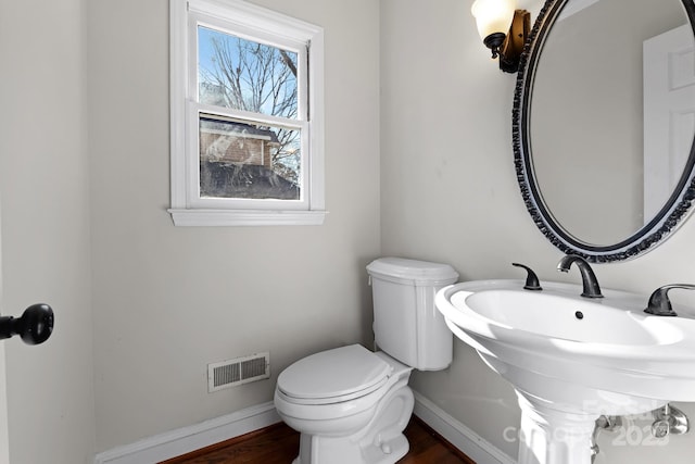 6017 Millbury Ct, Charlotte, NC 28211 - half bathroom featuring toilet and wood finished floors