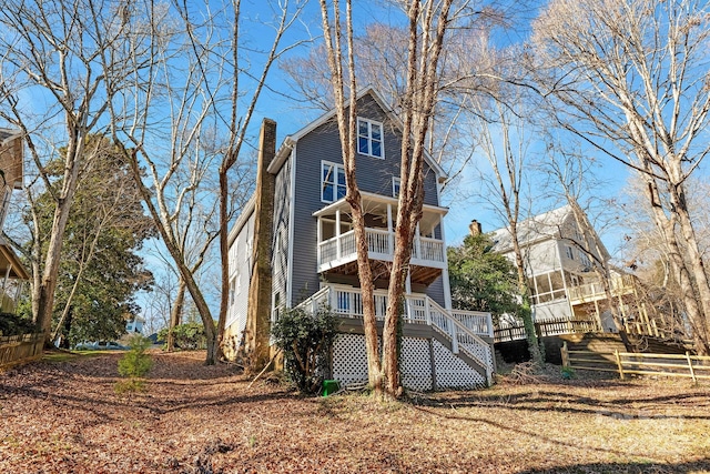 6017 Millbury Ct, Charlotte, NC 28211 - rear view of property with a chimney, stairway, and a balcony