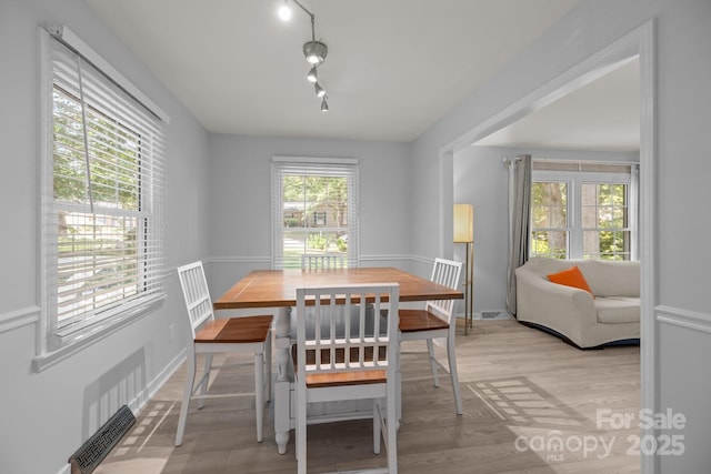 11329 Torino Rd, Matthews, NC 28105 - dining area featuring light wood-style floors and rail lighting
