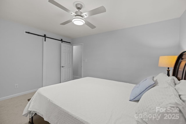 11329 Torino Rd, Matthews, NC 28105 - carpeted bedroom with a barn door and ceiling fan