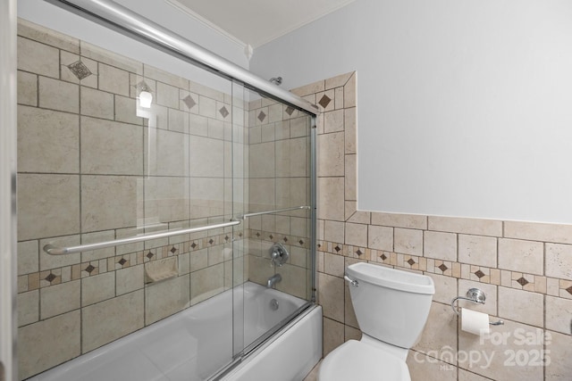11329 Torino Rd, Matthews, NC 28105 - bathroom with tile walls, bath / shower combo with glass door, and crown molding