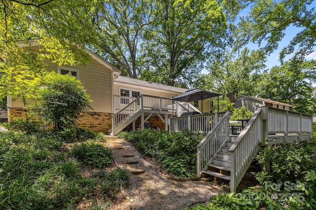 11329 Torino Rd, Matthews, NC 28105 - back of house with stairway, a wooden deck, and crawl space