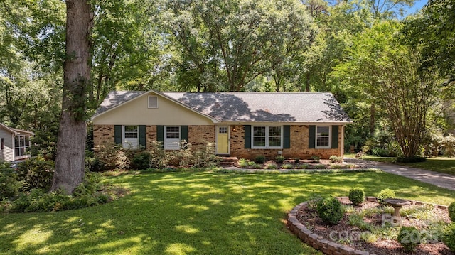 11329 Torino Rd, Matthews, NC 28105 - ranch-style home featuring brick siding and a front lawn