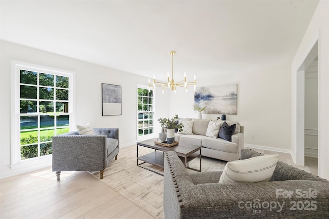 811 Ashmeade Rd, Charlotte, NC 28211 - living room featuring a chandelier and light wood-type flooring