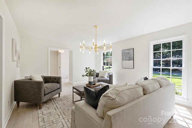 811 Ashmeade Rd, Charlotte, NC 28211 - living room featuring a chandelier and light wood finished floors