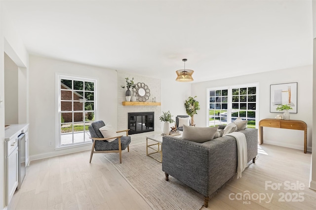 811 Ashmeade Rd, Charlotte, NC 28211 - living room with light wood-style flooring, plenty of natural light, and a fireplace