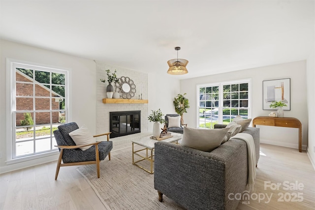 811 Ashmeade Rd, Charlotte, NC 28211 - living room featuring light wood-style flooring and a fireplace