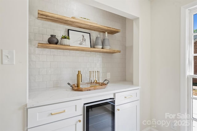 811 Ashmeade Rd, Charlotte, NC 28211 - bar featuring wine cooler and tasteful backsplash