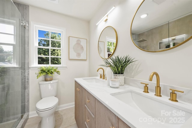 811 Ashmeade Rd, Charlotte, NC 28211 - bathroom featuring double vanity, a tile shower, and tile patterned flooring