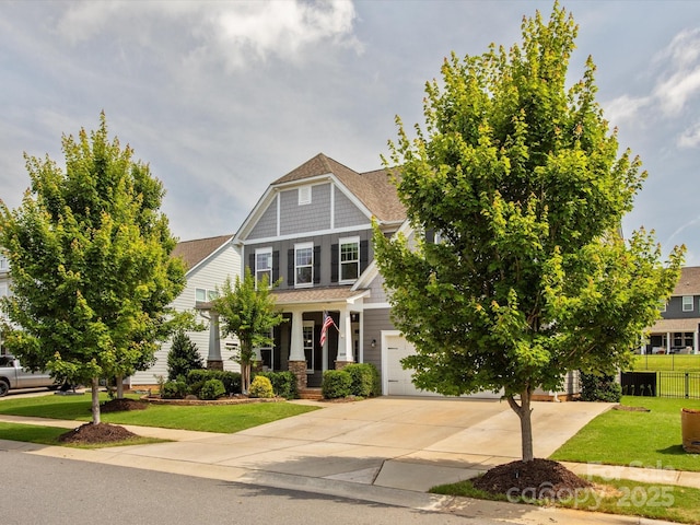 1009 Hampton Grove Rd, Waxhaw, NC 28173 - craftsman house featuring concrete driveway, roof with shingles, an attached garage, and a porch