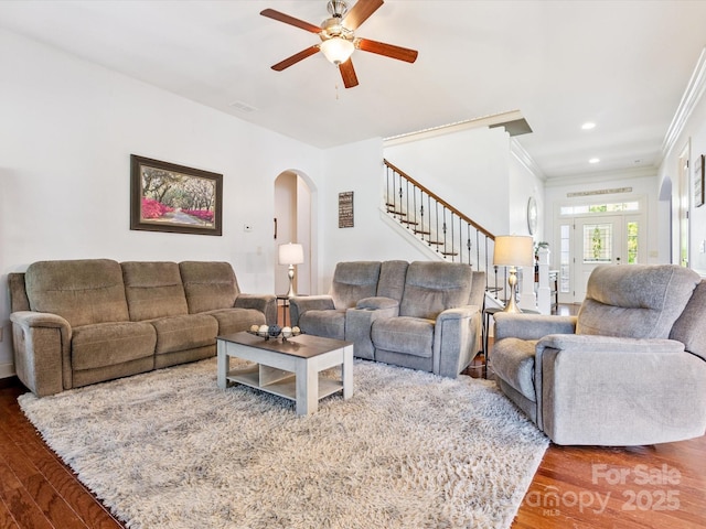 1009 Hampton Grove Rd, Waxhaw, NC 28173 - living area with arched walkways, wood finished floors, ceiling fan, ornamental molding, and stairway