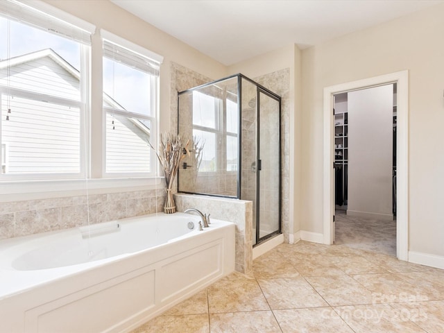 1009 Hampton Grove Rd, Waxhaw, NC 28173 - bathroom with a garden tub, a shower stall, a spacious closet, and tile patterned flooring
