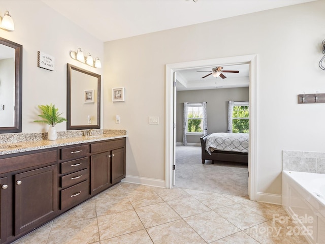 1009 Hampton Grove Rd, Waxhaw, NC 28173 - bathroom with double vanity, a ceiling fan, a garden tub, tile patterned floors, and ensuite bathroom