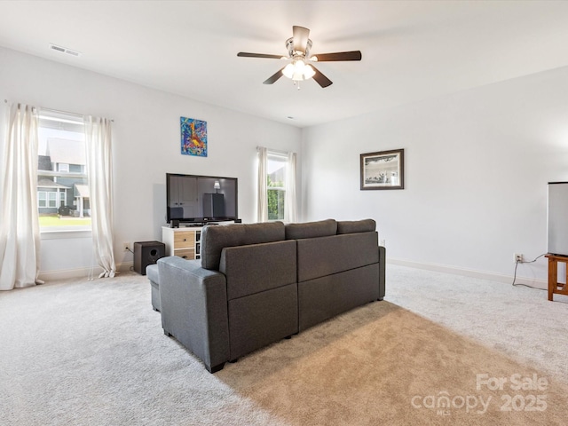 1009 Hampton Grove Rd, Waxhaw, NC 28173 - living room with light colored carpet, healthy amount of natural light, and a ceiling fan