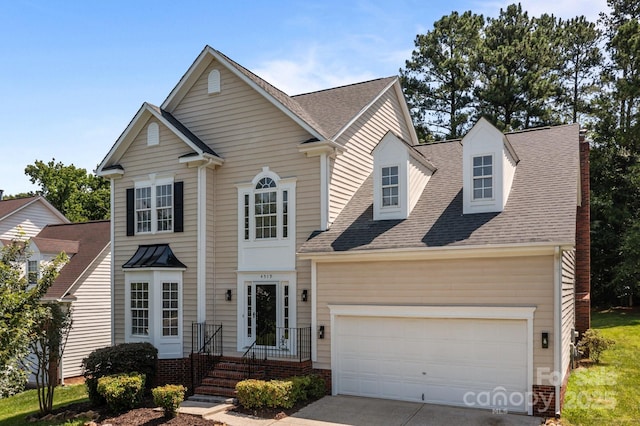 4519 Rock Stream Dr, Charlotte, NC 28269 - traditional-style home with concrete driveway, a shingled roof, and an attached garage