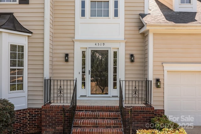 4519 Rock Stream Dr, Charlotte, NC 28269 - doorway to property featuring a garage and a shingled roof
