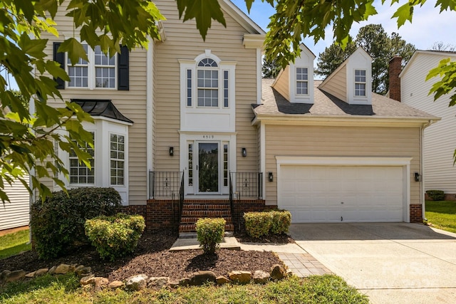 4519 Rock Stream Dr, Charlotte, NC 28269 - traditional home featuring driveway, an attached garage, and a shingled roof